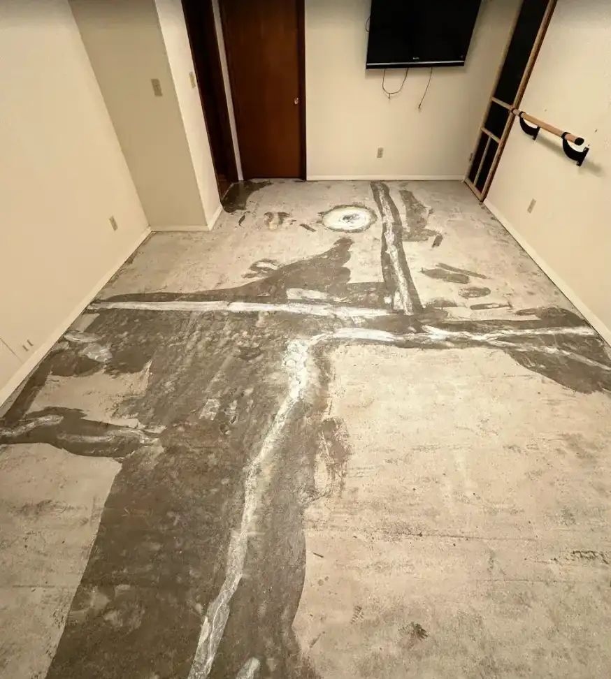 Raw residential garage concrete slab before floor coating installation